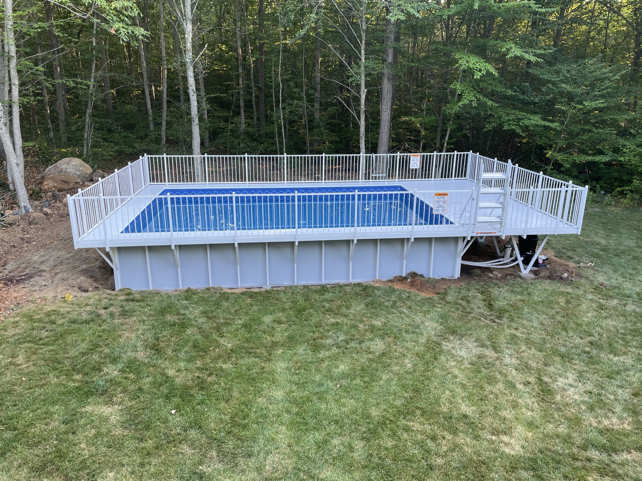 Before Kayak pool conversion with white fence